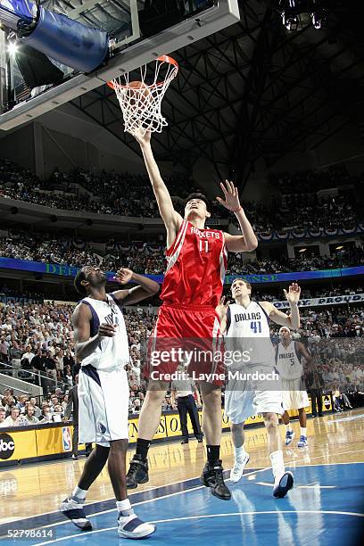 Yao Ming of the Houston Rockets shoots a layup in Game five of the Western Conference Quarterfinals with the Dallas Mavericks during the 2005 NBA...