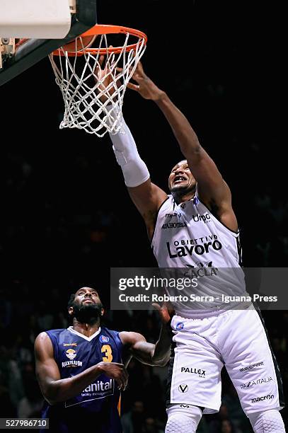 Dexter Pittman of Obiettivo Lavoro competes with DJ White of Manital during the LegaBasket match between Virtus Obiettivo Lavoro Bologna v Auxilium...