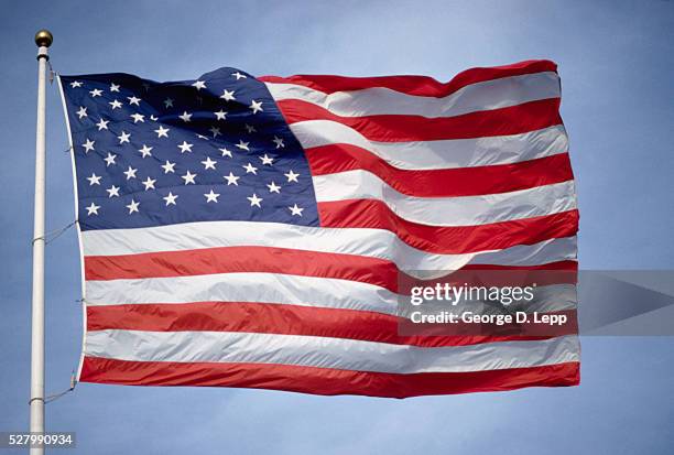 american flag waving in wind - bandera estadounidense fotografías e imágenes de stock