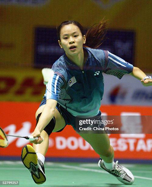 Wong Mew Choo of Malaysia returns a shot during a women's single match at the 2005 Sudirman Cup - World Mixed Team Badminton Championships at the...
