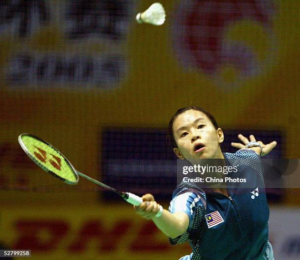 Wong Mew Choo of Malaysia returns a shot during a women's single match at the 2005 Sudirman Cup - World Mixed Team Badminton Championships at the...
