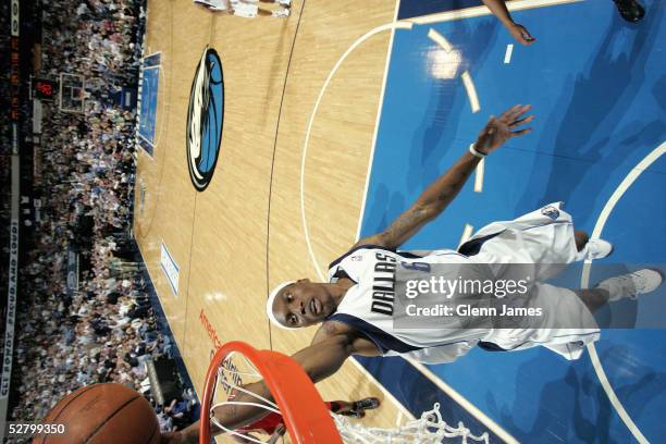 Marquis Daniels of the Dallas Mavericks dunks in Game five of the Western Conference Quarterfinals with the Houston Rockets during the 2005 NBA...