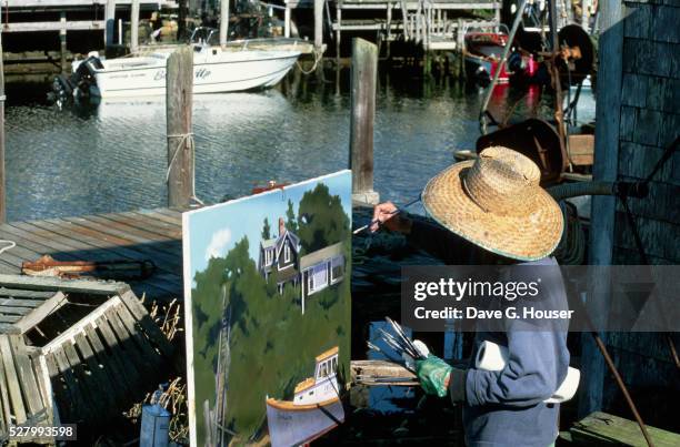 painter on a dock - menemsha stock pictures, royalty-free photos & images