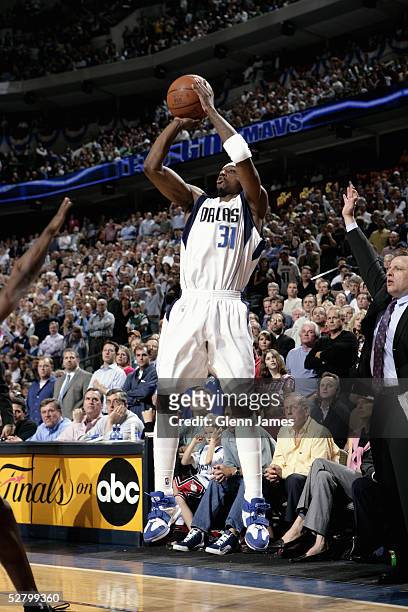 Jason Terry of the Dallas Mavericks takes a jump shot in Game five of the Western Conference Quarterfinals with the Houston Rockets during the 2005...