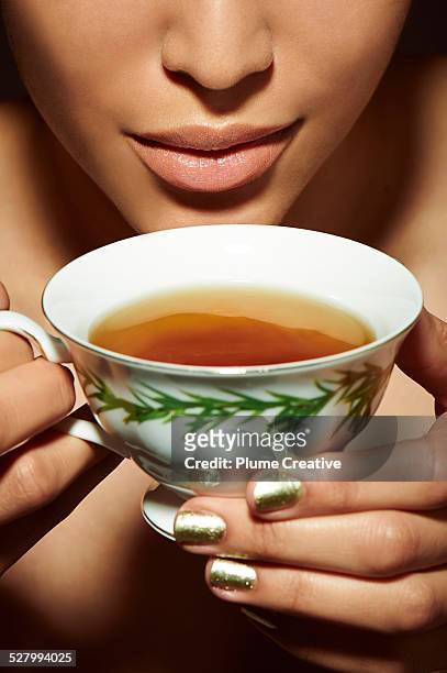 wellness - woman drinking tea stock pictures, royalty-free photos & images