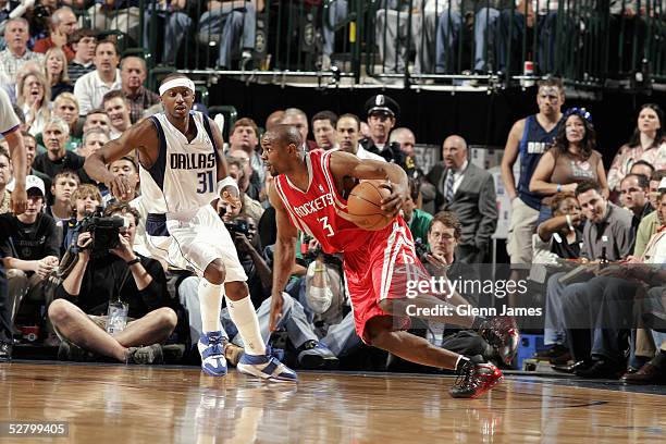 Jason Terry of the Dallas Mavericks guards Mike James of the Houston Rockets in Game five of the Western Conference Quarterfinals during the 2005 NBA...