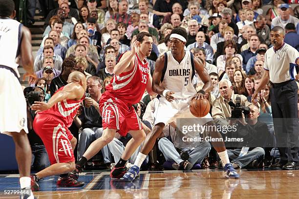 Josh Howard of the Dallas Mavericks moves the ball against Scott Padgett of the Houston Rockets in Game five of the Western Conference Quarterfinals...