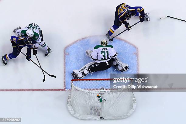 Troy Brouwer of the St. Louis Blues scores a goal against Antti Niemi of the Dallas Stars in Game Three of the Western Conference Second Round during...