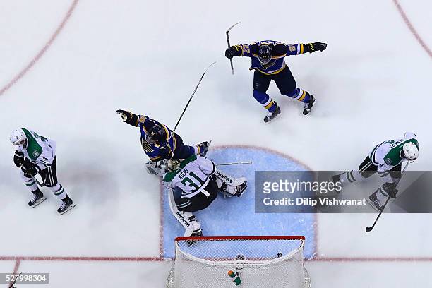 Troy Brouwer and Alex Pietrangelo of the St. Louis Blues celebrate after Brouwer scored a goal against Antti Niemi of the Dallas Stars in Game Three...
