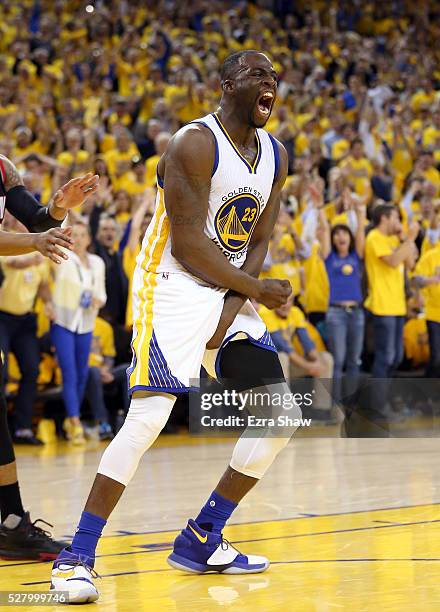 Draymond Green of the Golden State Warriors reacts after dunking the ball during their game against the Portland Trail Blazers in Game Two of the...