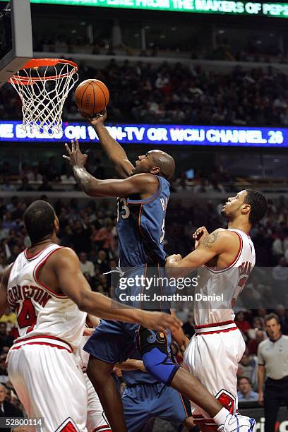 Tyson Chandler of the Chicago Bulls tries to block a shot by Brendan Haywood of the Washington Wizards in Game five of the Eastern Conference...