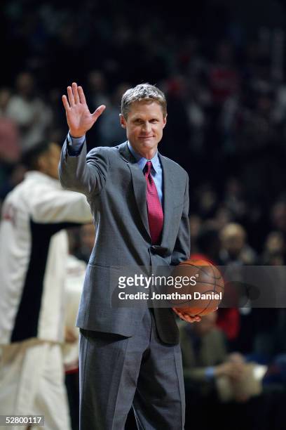 Former Chicago Bull and TNT announcer Steve Kerr waves in Game five of the Eastern Conference Quarterfinals with the Washington Wizards during the...