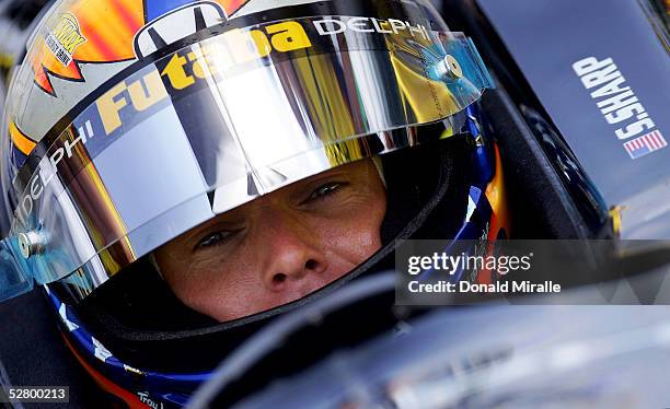 Scott Sharp, driver of the Delphi Fernandez Racing Panoz Honda, looks on from his car during practice for the 89th Indianapolis 500-Mile Race at the...