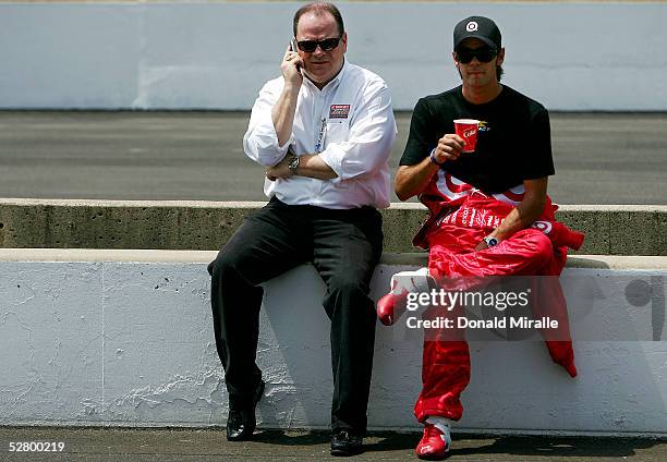 Team owner Chip Ganassi sits with Darren Manning, driver of the Target Chip Ganassi Panoz Toyota, in action during practice for the 89th Indianapolis...