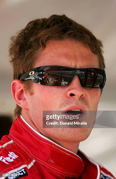 Scott Dixon, driver of the Target Chip Ganassi Panoz Toyota, looks on during practice for the 89th Indianapolis 500-Mile Race at the Indianapolis...