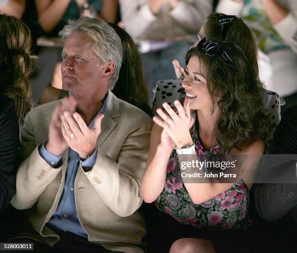 Michael Douglas and Catherine Zeta-Jones during Olympus Fashion Week Spring 2006 - Michael Kors - Front Row and Backstage at Bryant Park in New York...