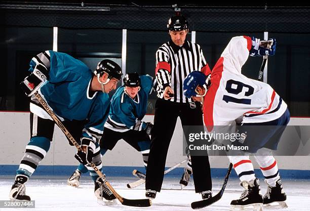 referee preparing to drop the puck - ice hockey uniform stock pictures, royalty-free photos & images