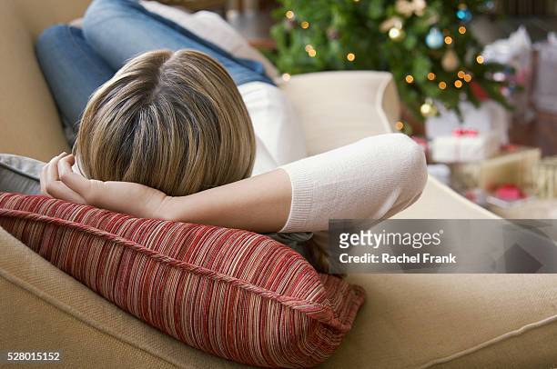 woman relaxing - woman back pillow blonde stock pictures, royalty-free photos & images