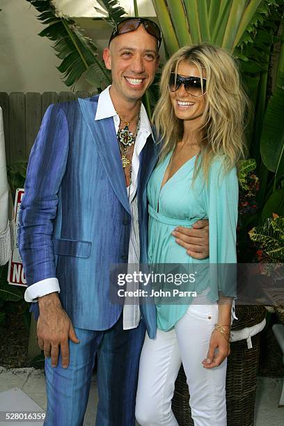 Robert Verdi in Chanel sunglasses with Marisa Miller in Vogue sunglasses