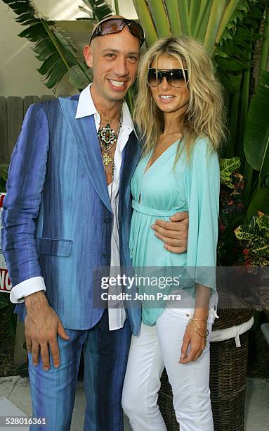 Robert Verdi in Chanel sunglasses with Marisa Miller in Vogue sunglasses