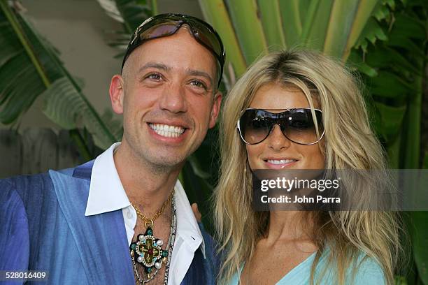 Robert Verdi in Chanel sunglasses with Marisa Miller in Vogue sunglasses