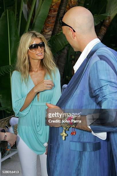Robert Verdi in Chanel sunglasses with Marisa Miller in Vogue sunglasses