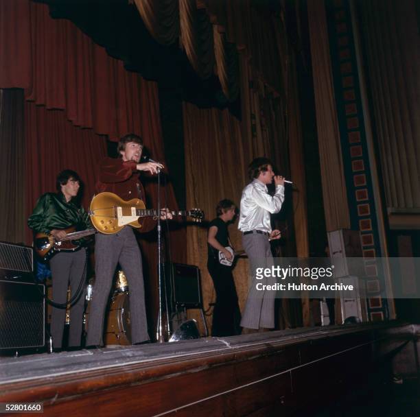 British pop group The Hollies performing on stage, November 1966. Group members Allan Clarke, Graham Nash, Tony Hicks, and new boy Bernie Calvert are...