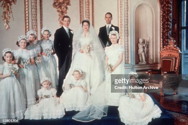 Princess Margaret and her new husband Antony Armstrong Jones pose for a picture with their bridesmaids at Buckingham Palace, 6th May 1960.