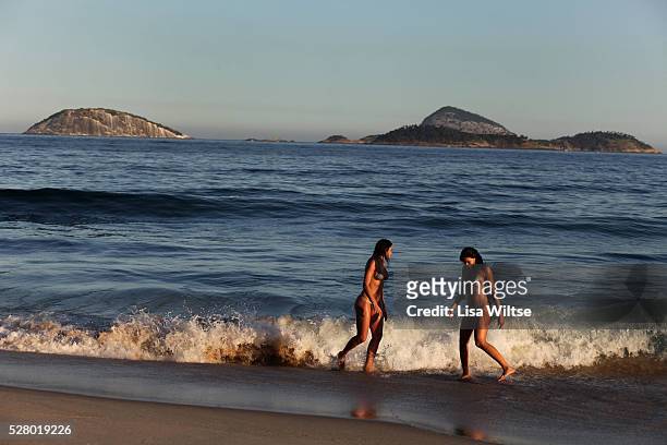 Women in g-string bikinis swim at Ipanema beach in Rio de Janeiro, Brazil July 2010. Photo by Lisa Wiltse