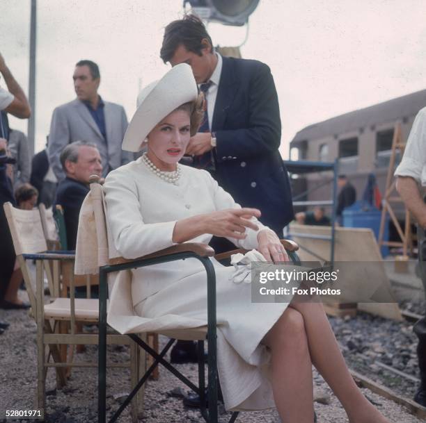 Swedish actress Ingrid Bergman wearing a white suit in Rome while filming 'The Lady's Vengeance' which was released as 'The Visit', directed by...