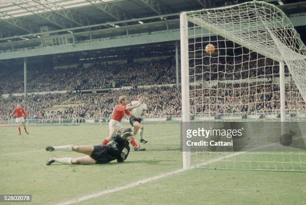 Geoff Hurst scores England's third goal against West Germany in the World Cup Final at Wembley Stadium, 30th July 1966. England went on to win the...