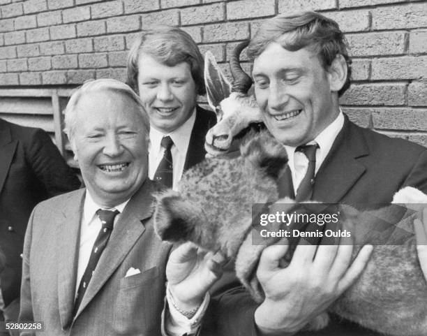 British Lions captain Willie John McBride poses at Heathrow Airport with Conservative leader Ted Heath and Fiji, a lion cub presented to the team by...