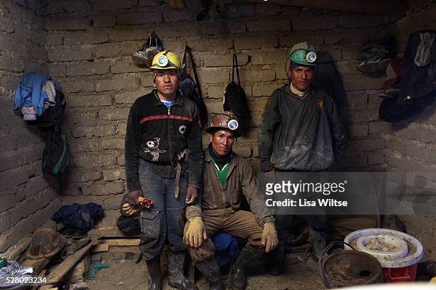 Miners pose for a portrait in their changing room hut after a double shift working in the Rosario mines in Potosi, Bolivia on May 5, 2010 . Photo by...