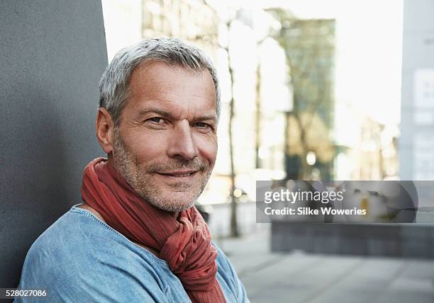 portrait of mature man smiling - 50 59 years stock pictures, royalty-free photos & images