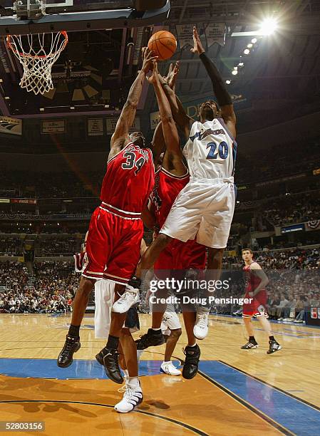 Antonio Davis of the Chicago Bulls rebounds against Larry Hughes of the Washington Wizards in Game four of the Eastern Conference Quarterfinals...