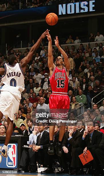 Jannero Pargo of the Chicago Bulls takes a jump shot against Gilbert Arenas of the Washington Wizards in Game four of the Eastern Conference...