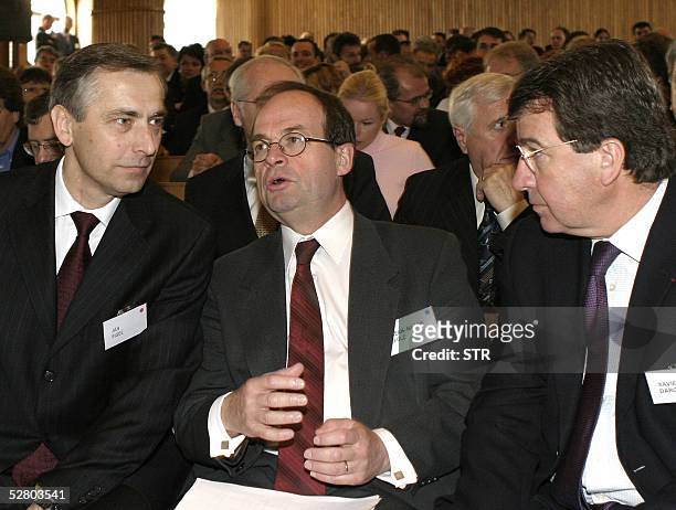 Eurocommissioner Jan Figel , PSA Peugeot Citroen President Jean Martin Folz and French Minister Delegate Xavier Darcos attend a function at the...