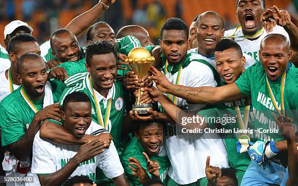 Nigeria,s Celebrate trophy Joseph Yobo during the 2013 Orange Africa Cup of Nations Final soccer match, Nigeria VS Burkina Faso at Soccer city...