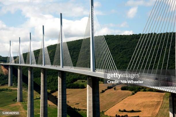 Millau Viaduct, a cable stayed road bridge over the River Tarn near Millau in Aveyron designed by architect Norman Foster 1125 feet at it its tallest...