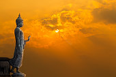Buddha statue with sun
