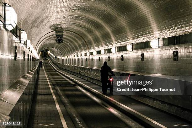 tunnel under the elbe in hamburg - fahrradlampe stock-fotos und bilder