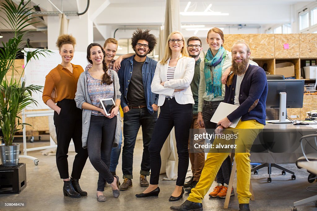 Multi-ethnic business people smiling in office
