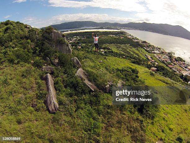 slackline over lagoa da conceicao - conceicao stock pictures, royalty-free photos & images