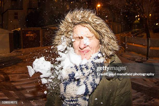 snowball hitting lady - snowball stock pictures, royalty-free photos & images