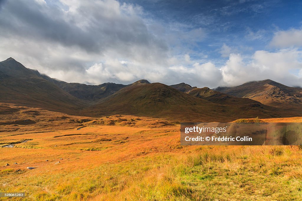 Sunny mountain range in Scottish Highlands