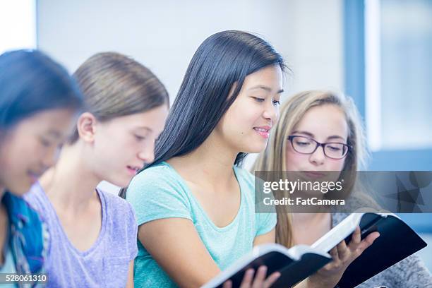 reading scripture together - christian college stock pictures, royalty-free photos & images