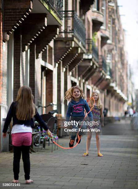 jumping rope in amsterdam - wijn stock pictures, royalty-free photos & images