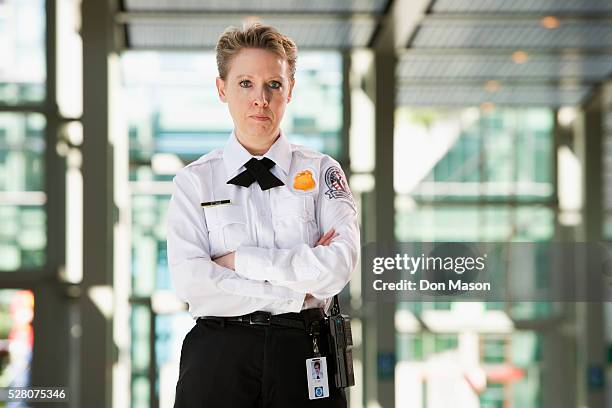 airport security guard - women security uniforms stock pictures, royalty-free photos & images