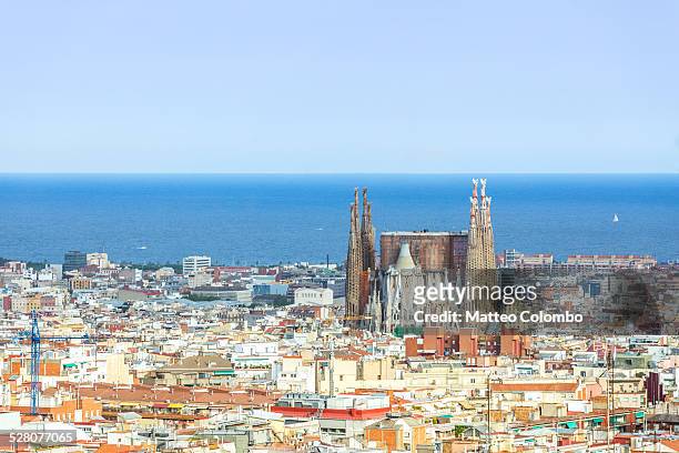 aerial of sagrada familia and city of barcelona - barcelona day photos et images de collection