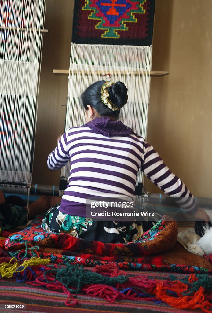 Uzbek woman weaving